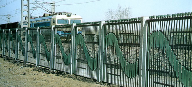 barbed wire fence--highway/railway fence